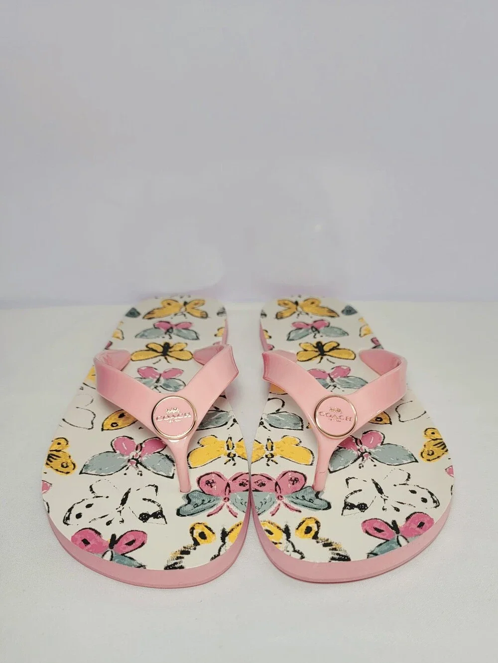 Coach Women's Size 8B  Zayn Pink Butterfly flip flops Slides.